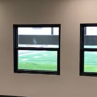 Windows looking out to the Jamie Hosford Football Center.